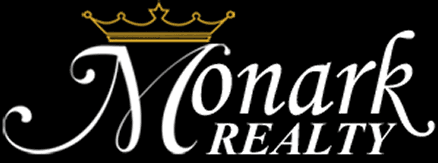Monark Realty logo with crown design.